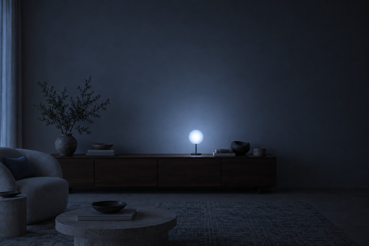 A quiet living room at night, softly lit by a blue globe lamp on a walnut console
