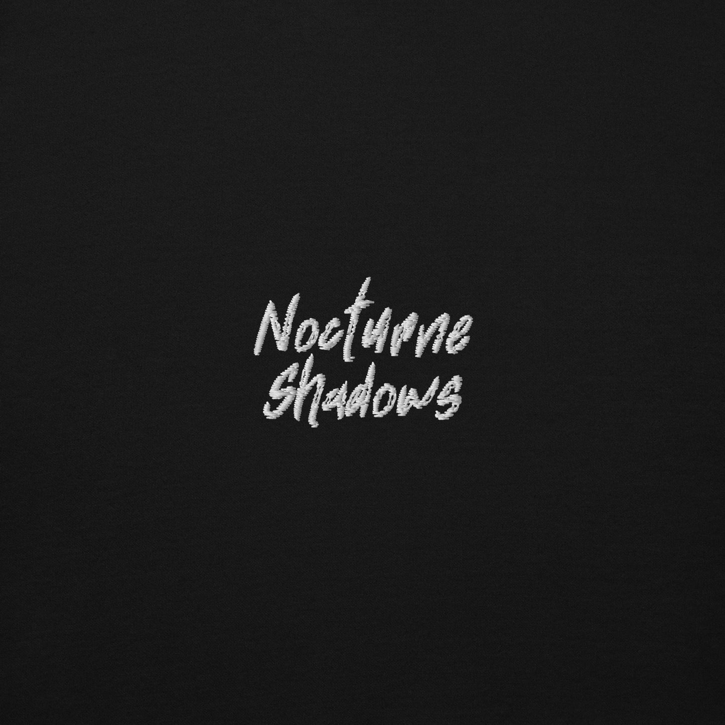 Nocturne Shadows chest embroidery detail on black fleece