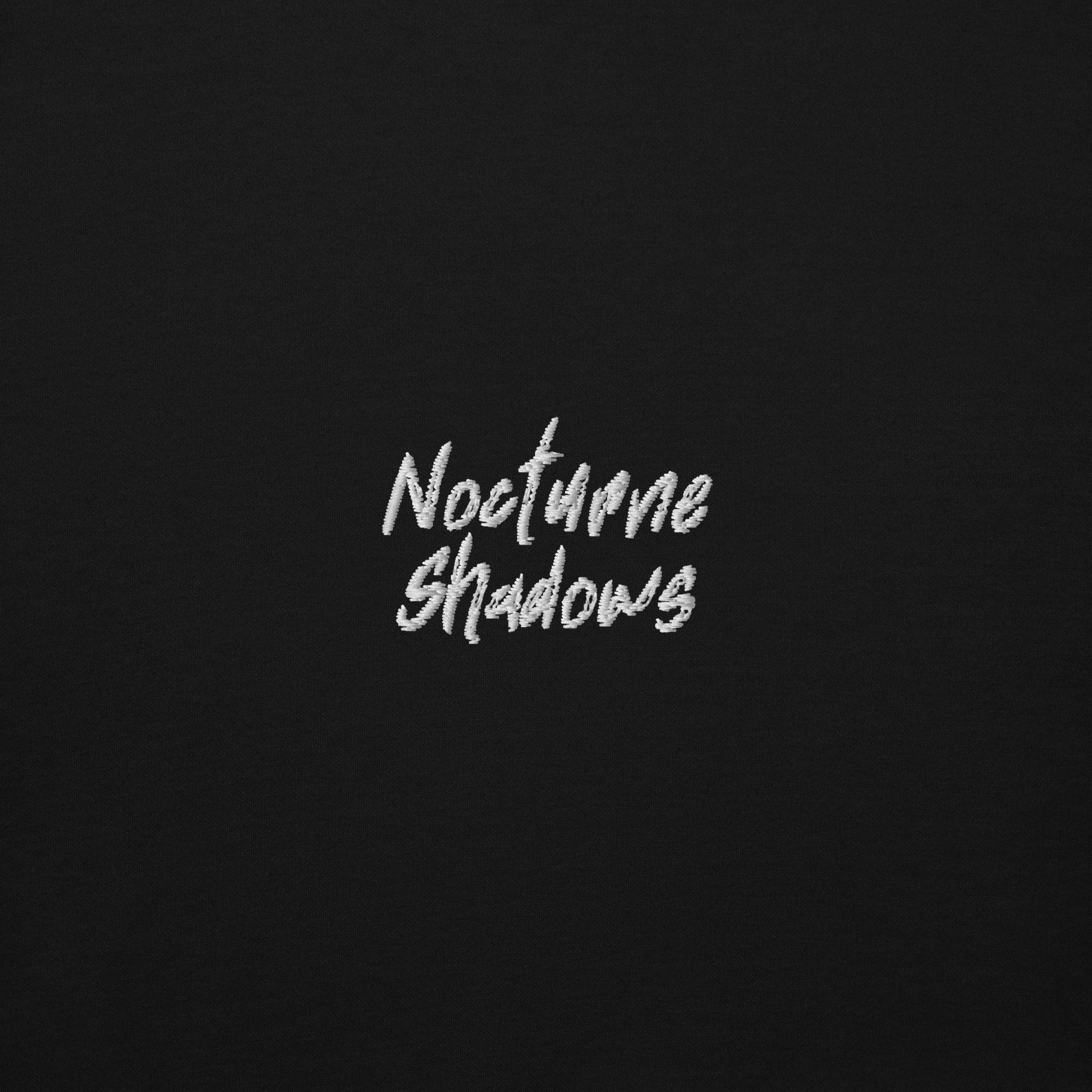 Nocturne Shadows chest embroidery detail on black fleece
