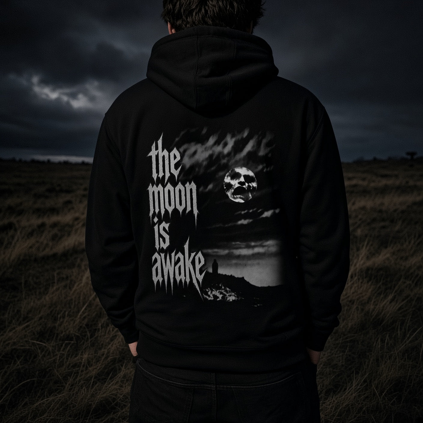 The Moon Is Awake heavyweight hoodie - full back artwork worn at night