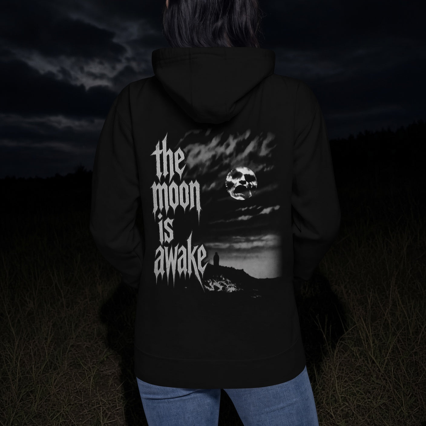 The Moon Is Awake hoodie - back artwork on women's fit worn at night