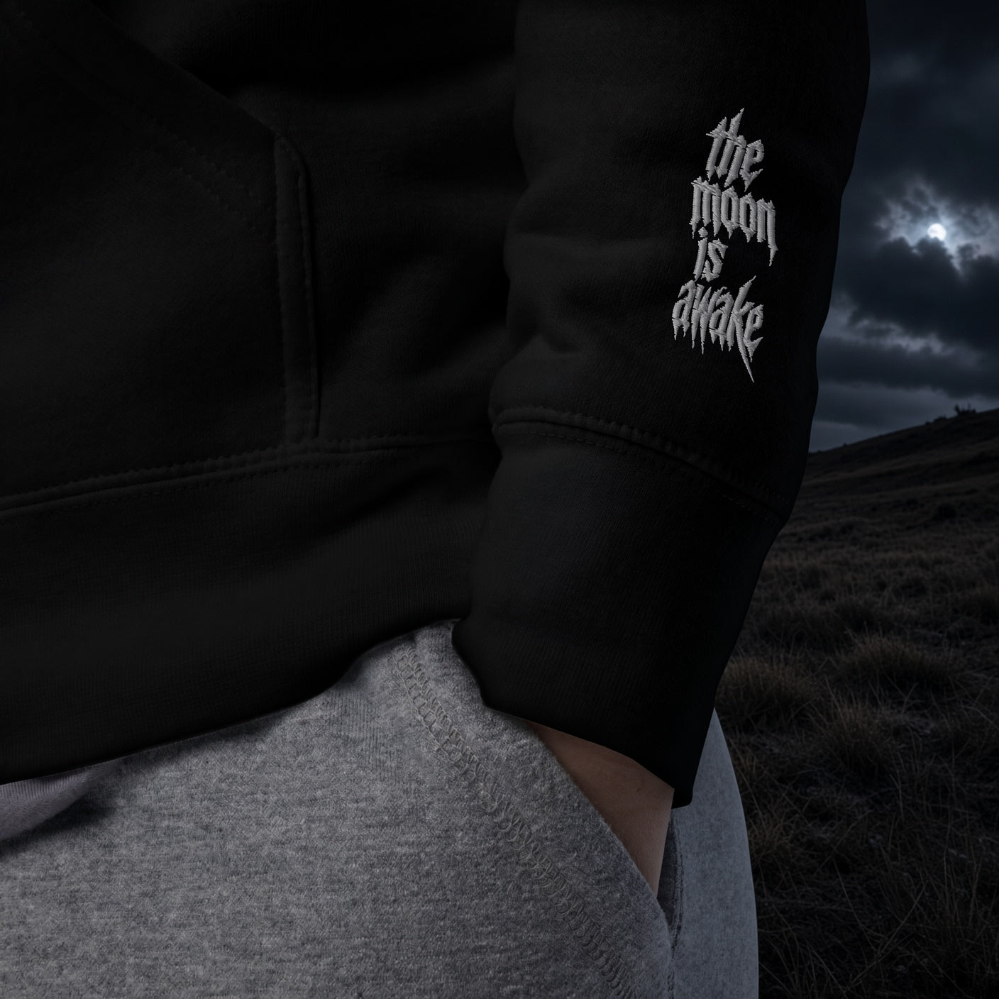 The Moon Is Awake hoodie - embroidered sleeve detail under the moon